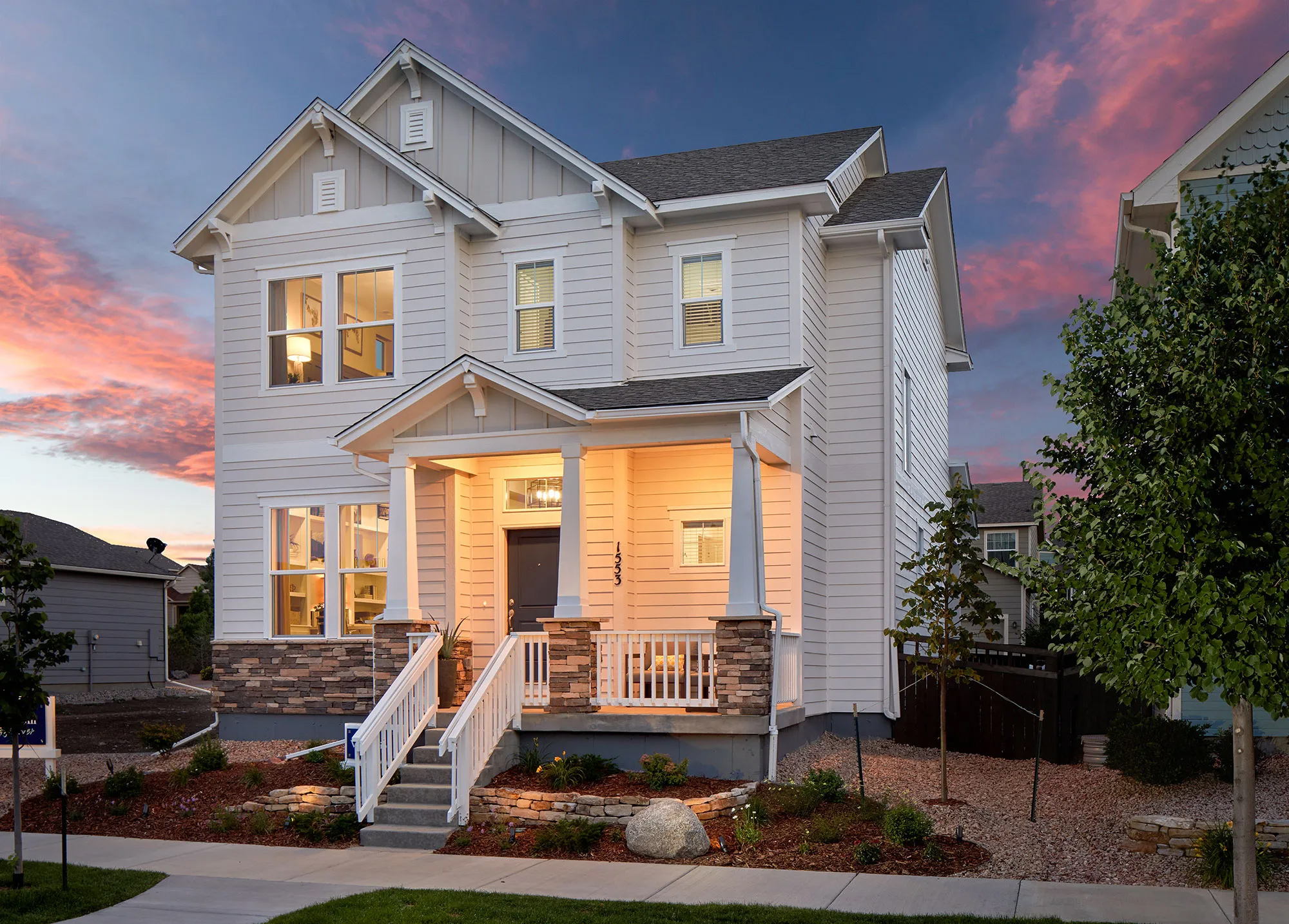 Modern home at sunset with porch